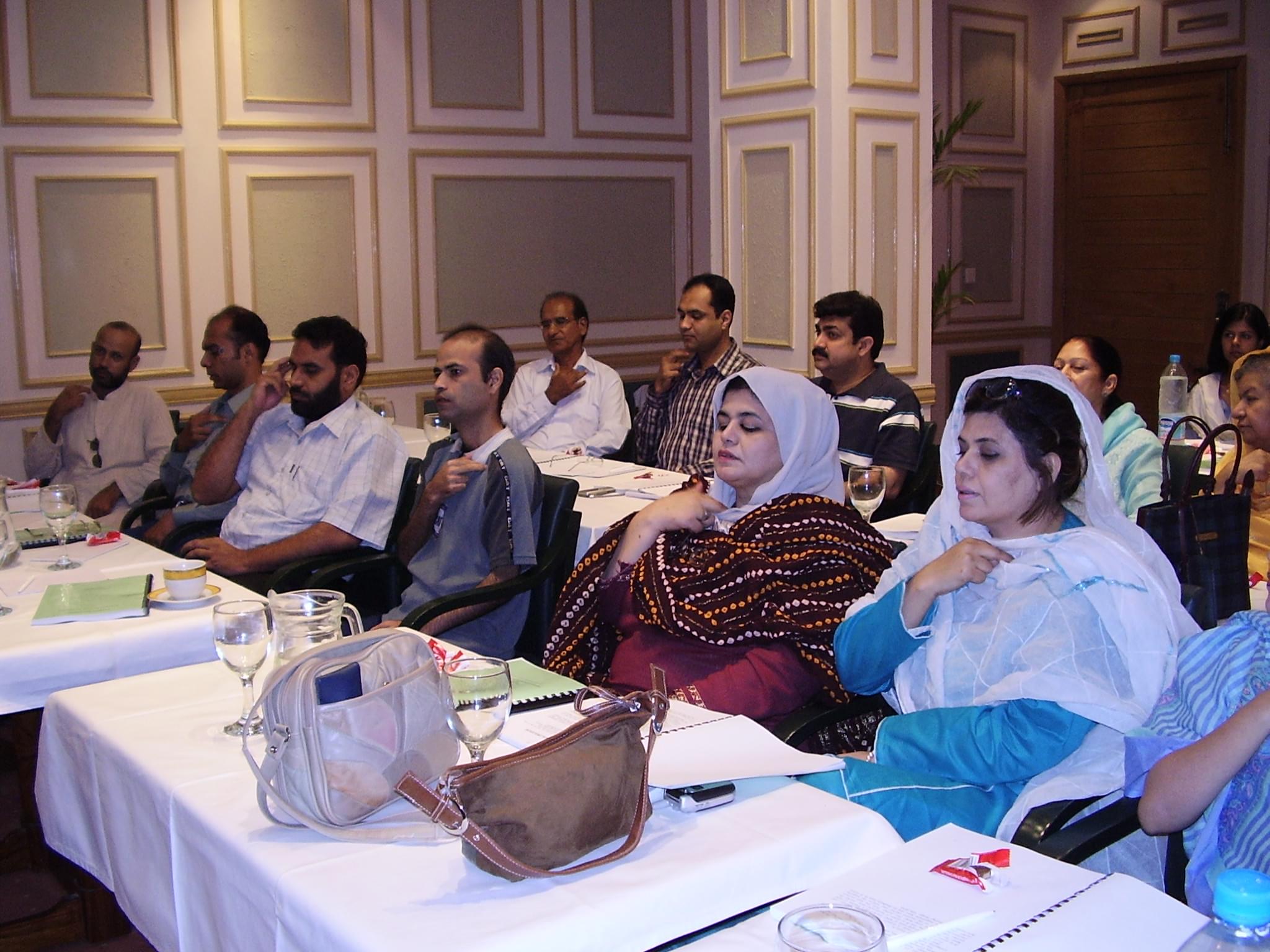 Participants practicing OMW energy tapping in an OMW tapping Workshop