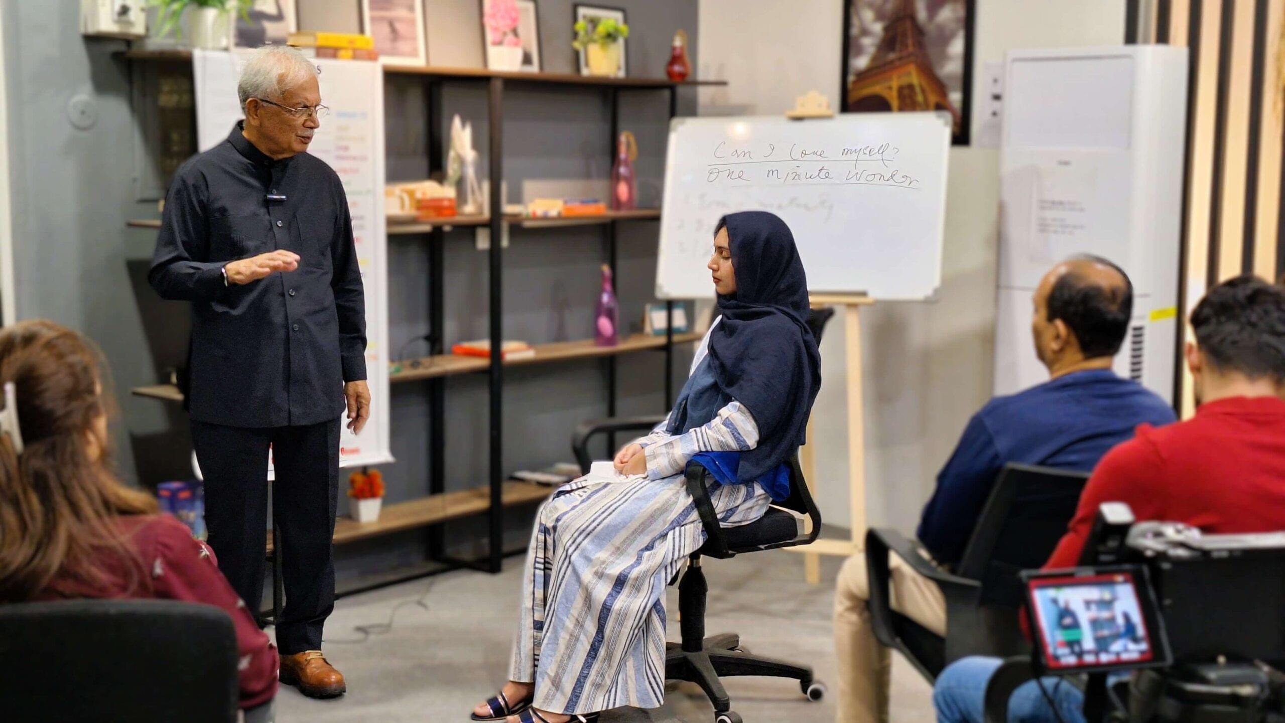 Dr imtiaz mehmud giving a healing to a clinical psychologist